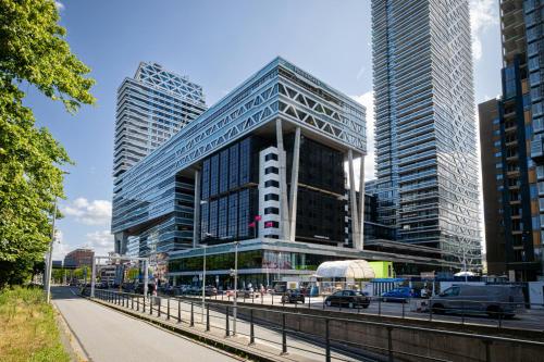a group of tall buildings in a city at Leonardo Hotel Den Haag Babylon in The Hague
