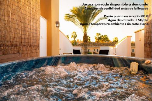 a jacuzzi tub in a building with water at TrendyHomes Laguna Beach in Vera