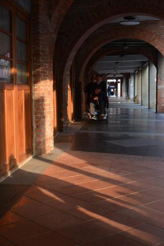 a hallway of a building with a person in a stroller at Meeting Mates Hostel in Taipei