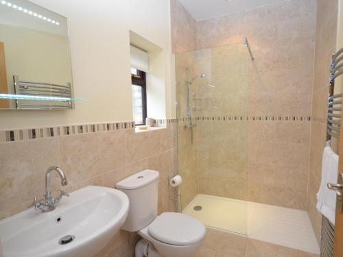 a bathroom with a toilet and a sink and a shower at 2 Bed in Chew Magna oc-chela in Stowey