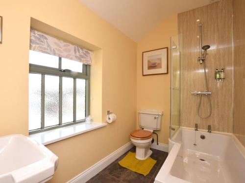 a bathroom with a toilet and a shower and a sink at 2 Bed in Consett oc-smidc in Lanchester