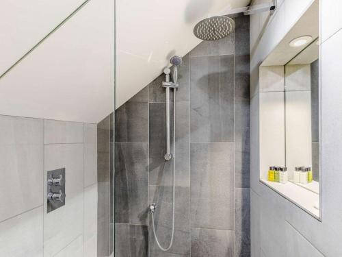 a shower with a glass door in a bathroom at 2 Bed in Bradford oc-75164 in Thornton