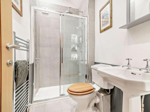 a bathroom with a shower and a toilet and a sink at 2 Bed in Taunton oc-93581 in Norton Fitzwarren