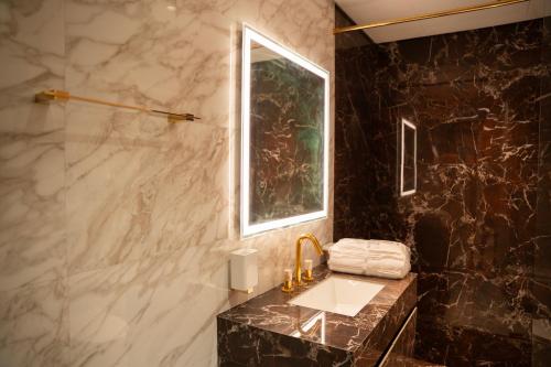 a bathroom with a sink and a window at Italian-Design 2BR l Large Private Terrace l Near Marina & Expo City in Dubai
