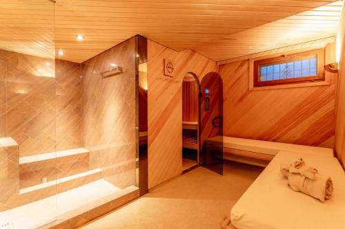 a small bathroom with a shower and a toilet at Chalet Eclipse, The Hidden Wonder in Hornkessel