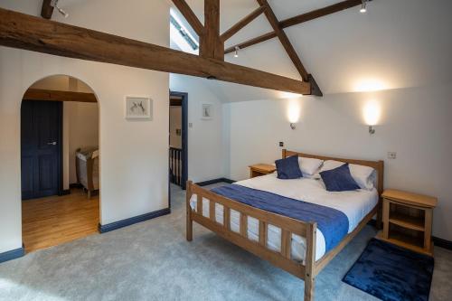 a bedroom with a large bed in a room at The Old Mill - Ripon Centre in Ripon
