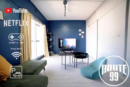 a living room with a couch and a tv at Hakone 8mins walk-modern style FreeNetflix Switch - Unit 204 in Hakone