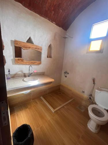 a bathroom with a sink and a toilet at Azru hotel siwa in Siwa