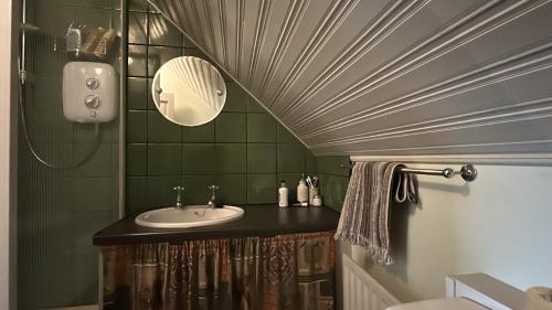 a bathroom with a sink and a ceiling at Doonloughan View, Ballyconneely in Ballyconneely