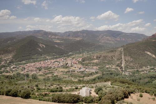 an aerial view of a town in the mountains at Cal Portalé - Casa de Pagès in Claverol