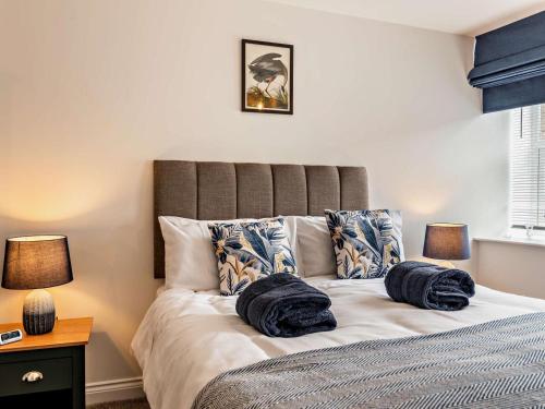 a bedroom with a bed with two pillows on it at 2 Bed in Holmfirth oc-95230 in Holmfirth