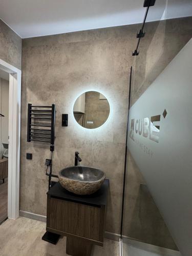 a bathroom with a sink and a mirror at CUBE Alpine Stay in Bürs