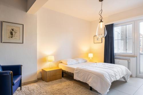 a bedroom with a bed and a window at Mercator 0301 in Ostend