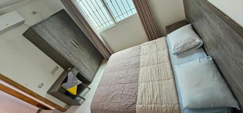 Llit o llits en una habitació de Square Resident