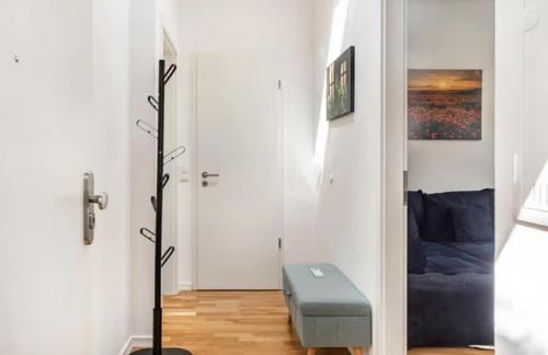 a room with a hallway with a white wall at Elb Park Suite in Wittenberge
