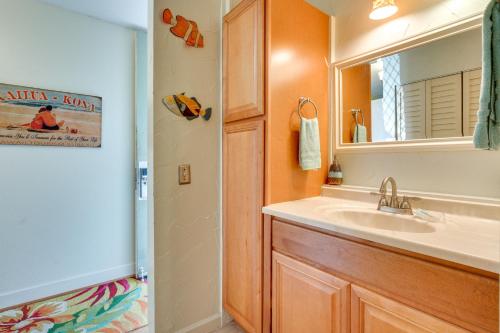 a bathroom with a sink and a mirror at First Responders Book With Us - Kona Islander Inn! in Kailua-Kona