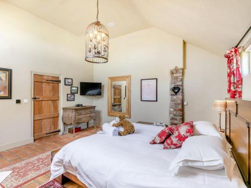 a bedroom with a large white bed and a desk at 2 Bed in York oc-g0073 in Ellerton