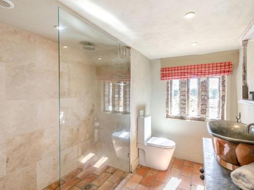 a bathroom with a toilet and a glass shower at 2 Bed in York oc-g0073 in Ellerton