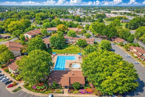 an overhead view of a resort with a pool and trees at Modern 3BR 2 bathroom Near High Point University & Market Sleeps 6 in High Point