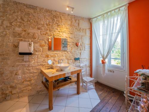 a bathroom with a sink and a window at Beautiful large stylish villa centrally located in Pons in Pons