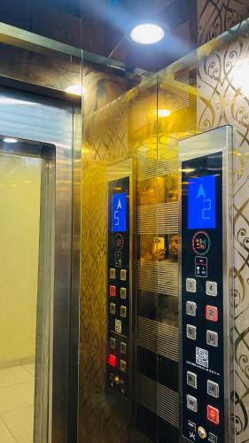 an elevator with two vending machines in a building at Divine Hotel in Zirakpur