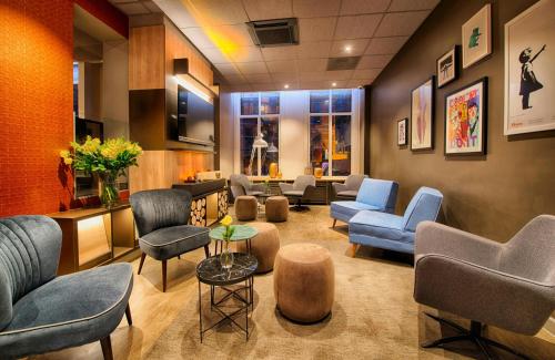a waiting room with couches and chairs at Leonardo Boutique Hotel Amsterdam Vondelpark in Amsterdam