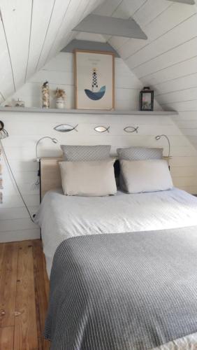 a bedroom with a large bed in a room at Chambrecosy maison de charme proche gare et centre historique in Quimper