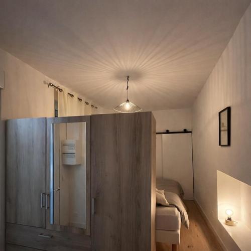 a room with a closet and a bed in it at Instant Angers Hyper Centre in Angers