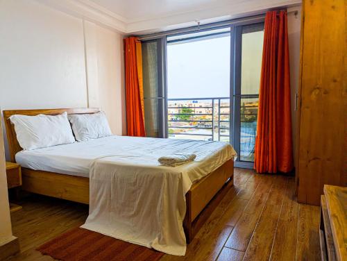 Llit o llits en una habitació de Résidence Houé