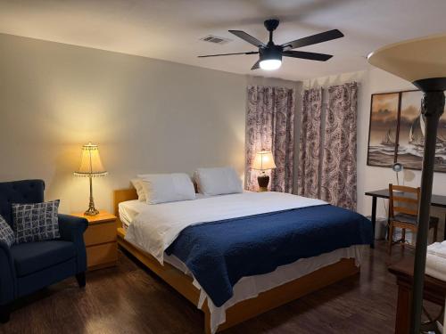 a bedroom with a bed and a ceiling fan at Historic Downtown McKinney 3BR in McKinney