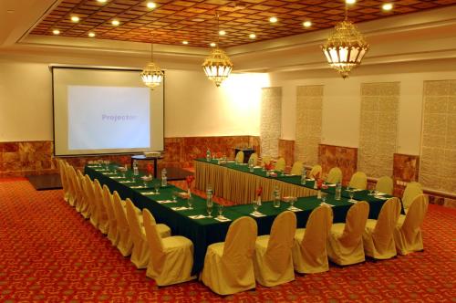 a meeting room with a long table and chairs at Faisalabad Serena Hotel in Faisalabad