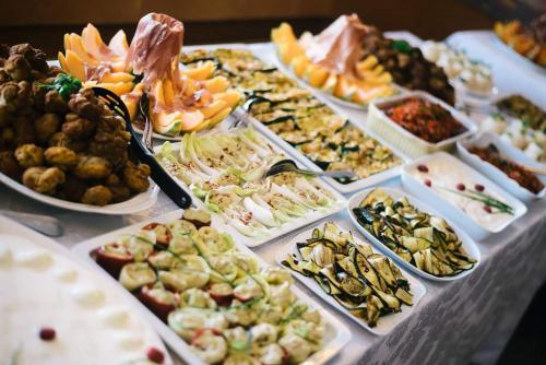 a table with many different types of food on it at Wald Cafe in Simbach am Inn