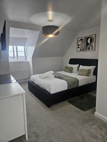 a bedroom with two beds in a room at The Brown Rest House in Gravesend