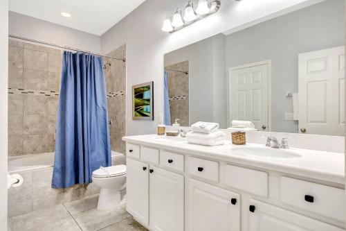 a bathroom with a sink and a toilet and a shower at Ev1339 - Sunset Palm Retreat in Davenport