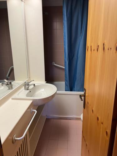 a bathroom with a sink and a toilet and a shower at Bilocale Casa Canazei in Alba di Canazei