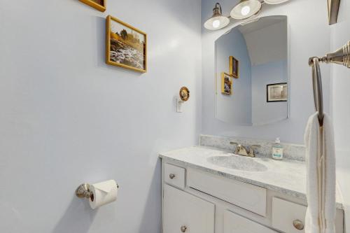 a bathroom with a sink and a mirror at Mad House in Waterville Valley