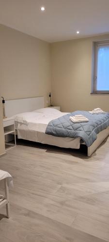 a bedroom with a large bed in a room at Casa Paolina in Premeno