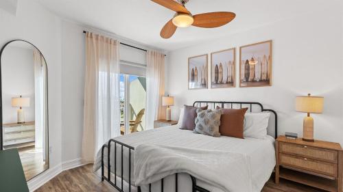 a bedroom with a bed and a ceiling fan at August Beach Escape Special Rates Available! in St. Pete Beach