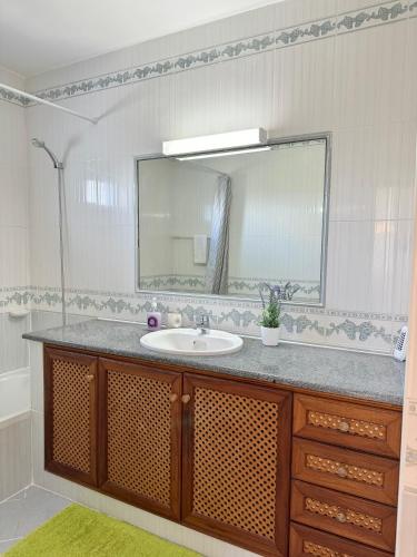 a bathroom with a sink and a mirror at Casa da Eira - Private Villa - pool - Free wi-fi - Air Con in Silves