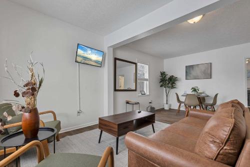 a living room with a couch and a table at Housepitality - The Southside Ranch in Columbus