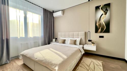a bedroom with a bed and a large window at MOLODIST 16 Irpin in Irpin