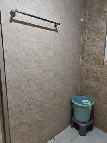 a shower stall with a toilet in a bathroom at Shivaya Homes in Chhatikara