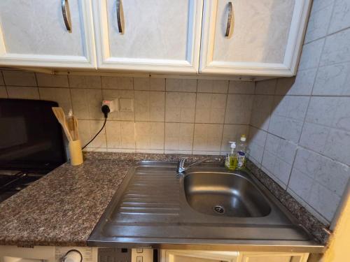 a kitchen with a sink and a counter top at Apartment in ajman in Ajman 
