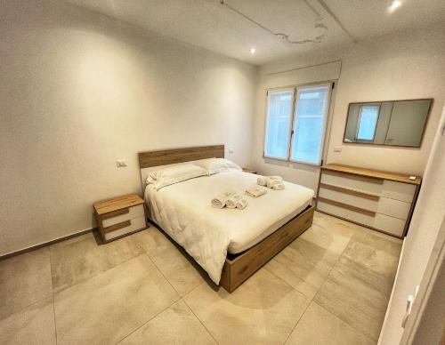 a bedroom with a bed and a television in it at Boutique Apartments Magenta in Magenta