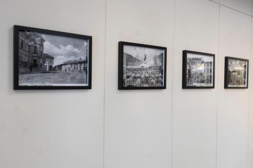 a group of pictures hanging on a wall at Albergo Ristorante Brera in Inveruno