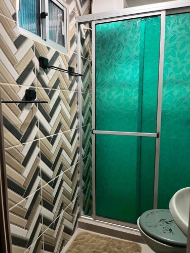 a bathroom with a shower with a glass door at Apartamento Tito in Barra del Chuy