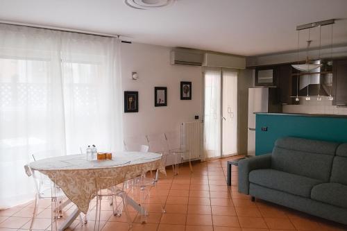 a living room with a table and a couch at B&B Casa Fortunata in Milan