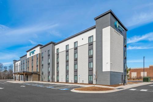 a rendering of a hotel building at WoodSpring Suites Charlotte Northlake in Charlotte