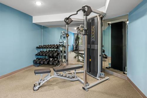 a fitness room with a gym with weights at WoodSpring Suites Charlotte Northlake in Charlotte