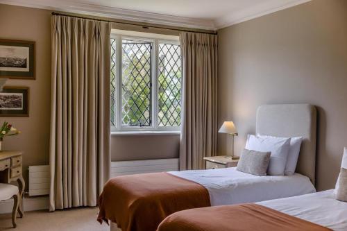 a hotel room with two beds and a window at 2 Bed in Ludlow oc-p31882 in Ludlow